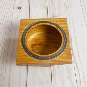 Osage Orange wooden bowl with square top and round opening and bowl - top view looking into the bowl