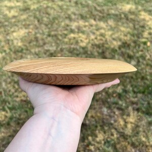 Cypress wooden potpourri bowl - being held in natural light - side view