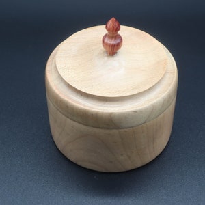 Wooden bowl made of maple and tulipwood with lid.
