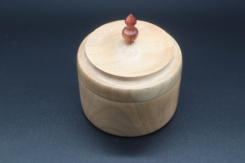 Wooden bowl made of maple and tulipwood with lid.