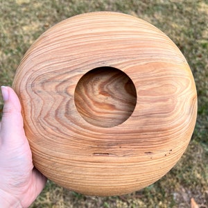 Cypress wooden potpourri bowl - being held in natural light - top view