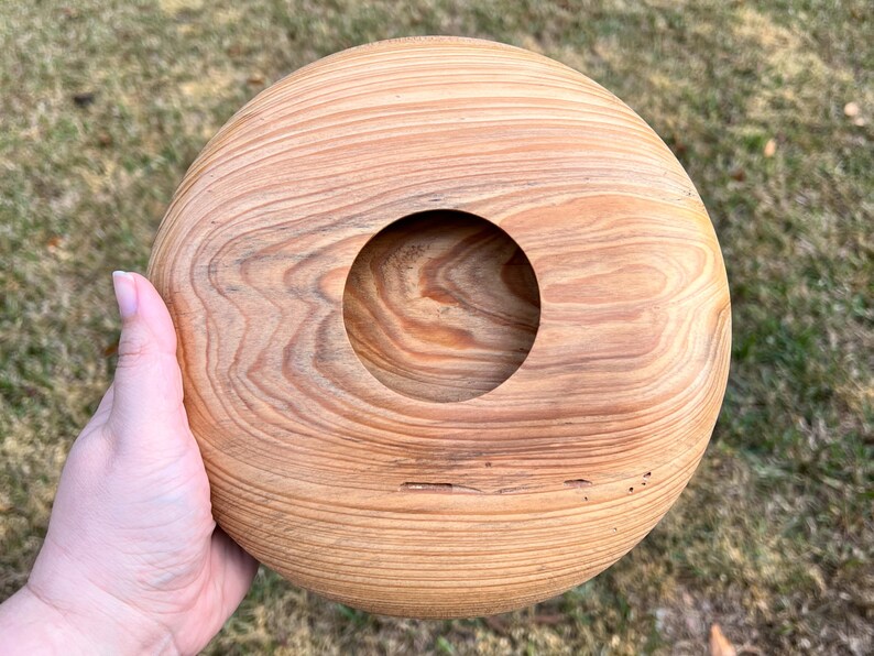 Cypress wooden potpourri bowl - being held in natural light - top view