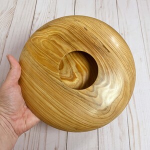 Cypress wooden potpourri bowl - being held - top view