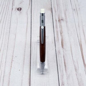 Full view of 2mm mechanical pencil made in black walnut wood - from the front - in a pencil holder.