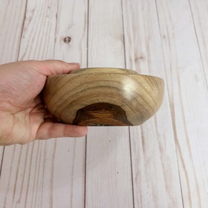 Camphor wood bowl - being held to show side view