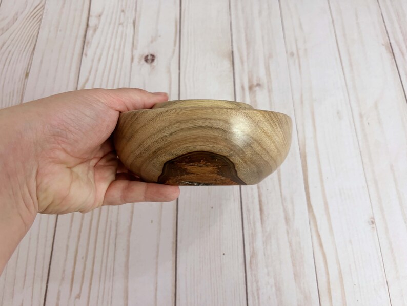 Camphor wood bowl - being held to show side view