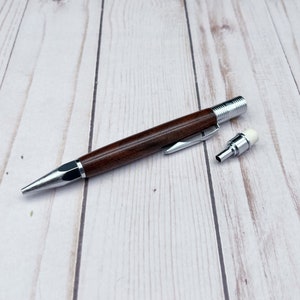 Side view of 2mm mechanical pencil made in black walnut wood - with the eraser/sharpener removed