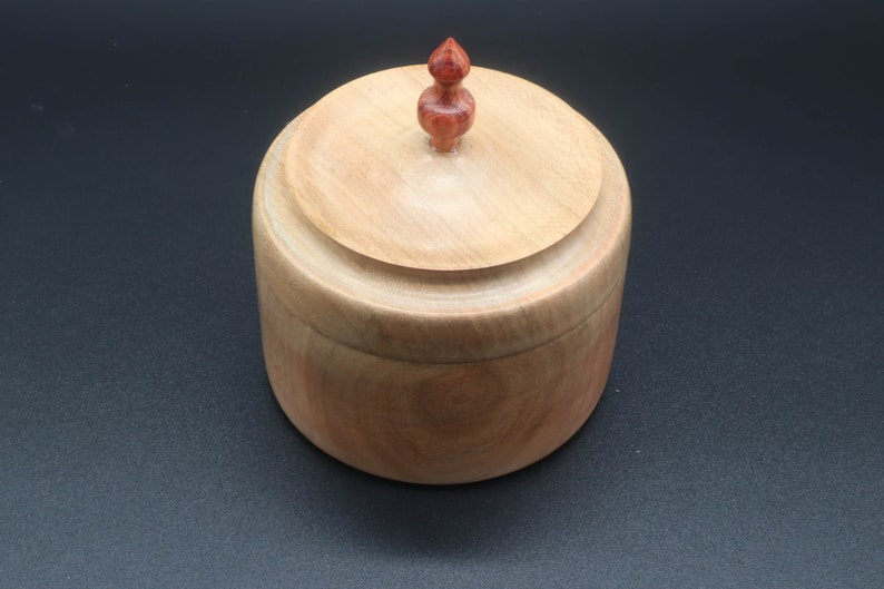Wooden bowl made of maple and tulipwood with lid.