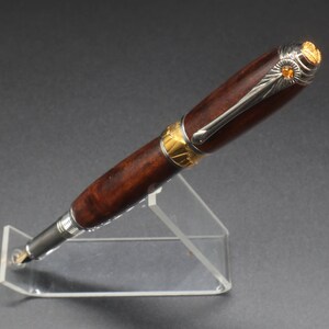 Front side view of fountain pen made of ringed gidgee wood.