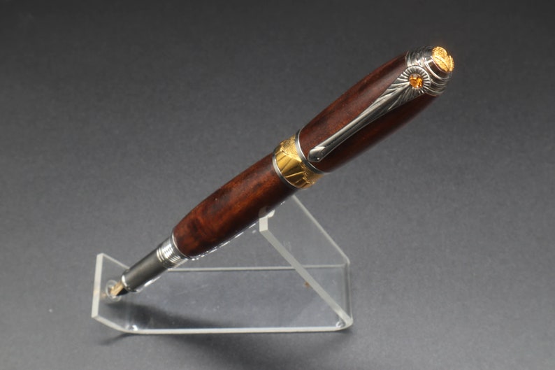Front side view of fountain pen made of ringed gidgee wood.