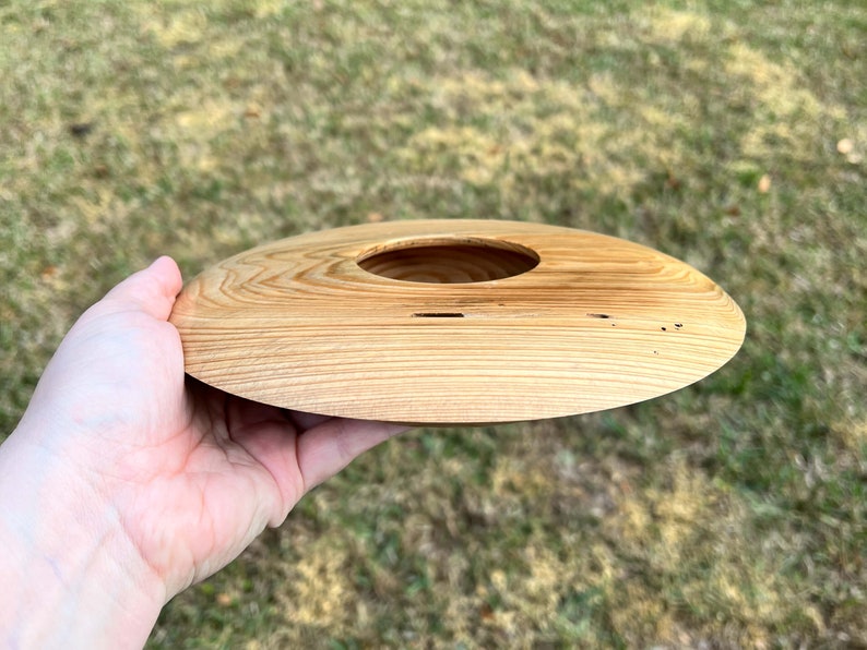 Cypress wooden potpourri bowl - being held in natural light - side view