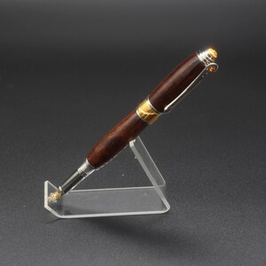 Front side view of fountain pen made of ringed gidgee wood.