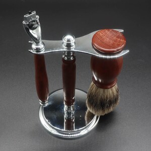 Eucalyptus shaving set with brush, stand, and razor handle over a dark background