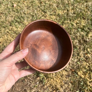 Indian Rosewood wooden bowl outside in natural light - showing inside of the bowl