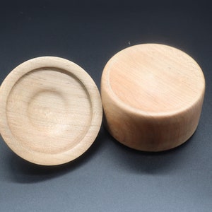 Wooden bowl made of maple and tulipwood with lid -- showing the bottom side of the bowl and the lid.