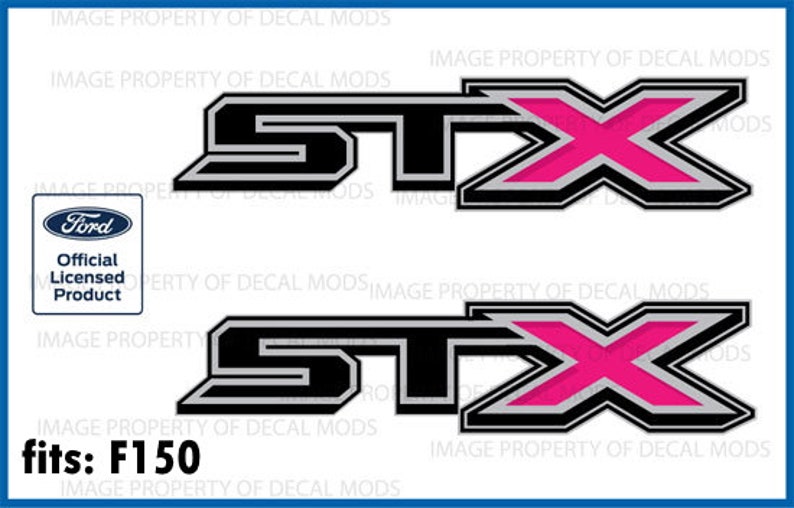 May include: Two black and silver decals with a pink "X" in the middle. The decals read "STX" and are for Ford F150 trucks.