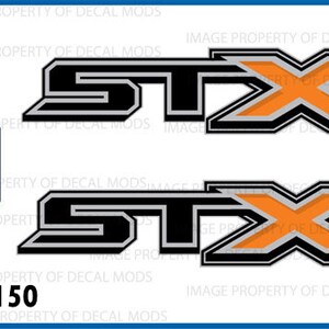 May include: Two black and silver decals with an orange X and the word "STX" in black. The decals are for Ford F150 trucks. The decals are officially licensed Ford products.