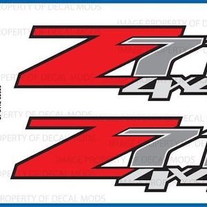May include: Two red and gray decals with the text "Z71 4X4". The decals are for a vehicle and are an officially licensed product.