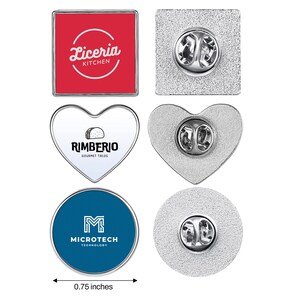 May include: Three metal lapel pins with silver-tone edges and butterfly clutch backings. One square red pin reads Liceria Kitchen, one white heart-shaped pin reads Rimberio Gourmet Tacos, and one blue circular pin reads Microtech Technology. 0.75 inches.