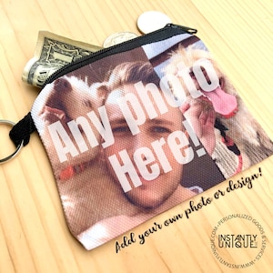 May include: A black zippered pouch with a white background and the text "Any photo Here! Add your own photo or design!" printed on it. The pouch has a photo of a person and two dogs on it.