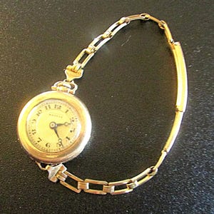 May include: A rustic wooden sign with the text "Welcome to our home" in white lettering. The sign features a distressed finish and a simple, inviting design, perfect for front door decor.