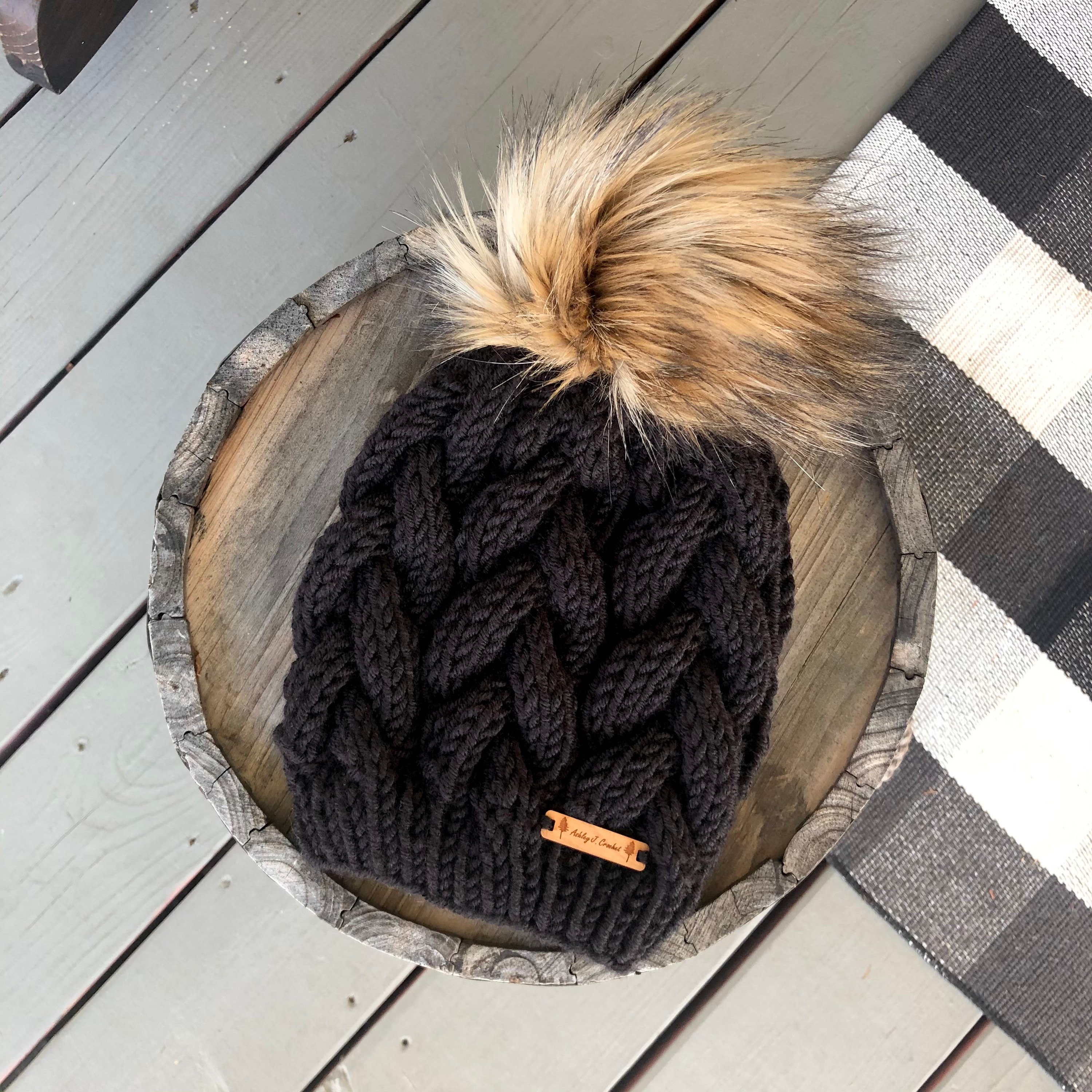 NWT, Skea, Big Pom Betty Hat. Gorgeous 9 inch Fur Pom, luxury Knit cable hat! Black Chunky Cable Knit Hat With Beige Faux Fur Pom Pom  main image 2