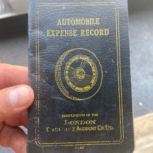 Antique automobile expense record logbook with nice illustrations inside . Vintage auto logbook