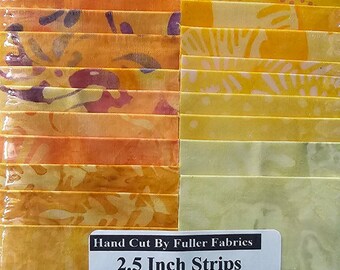 May include: A package of 30 hand-cut 2.5 inch strips of Java Citrus batik fabric. The fabric is a mix of yellow, orange, and red colors with various patterns. The package includes duplicates. Hand Cut By Fuller Fabrics.