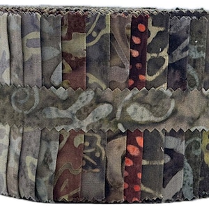 May include: A fabric roll featuring a variety of patterned fabrics in shades of brown, gray, and olive green. The fabrics are arranged vertically and held together by a decorative band with a scalloped edge. The roll is approximately 6 inches in diameter.