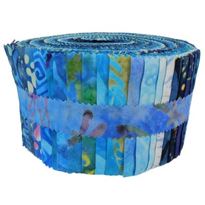May include: A roll of blue and green fabric scraps, perfect for quilting or crafting projects.