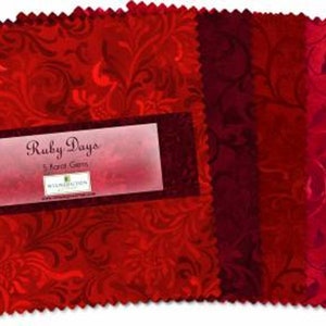 May include: A pack of five red fabric squares with a floral pattern. The fabric squares are labeled "Ruby Days 5-Inch Squares".