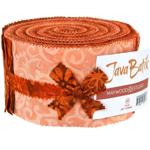 May include: A roll of 40 2 1/2 inch fabric strips in shades of orange and brown with a floral pattern. The fabric is labeled "Java Batik" and "Maywood Studio".