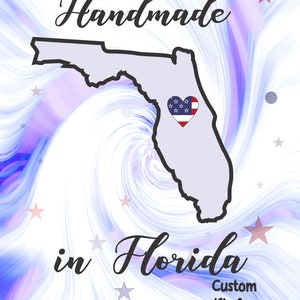 May include: A white background with a swirling blue and purple design. The outline of the state of Florida is in black with a red, white, and blue heart in the center. The text "Handmade in Florida" is in black cursive font. Below the state outline is the text "Custom gifts from The HEART!" in black font.