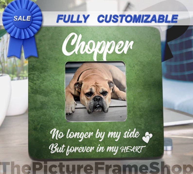 May include: A green picture frame with the name "Chopper" in white script. The frame features a photo of a dog and the text "No longer by my side But forever in my HEART". A blue ribbon with "SALE" is in the upper left corner.