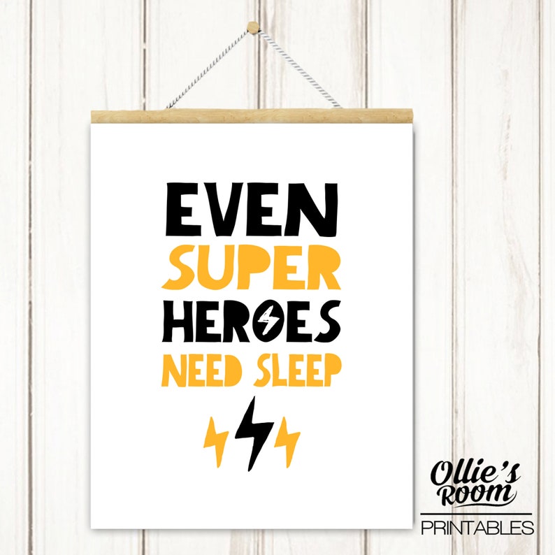May include: Black and yellow printable wall art with the text "Even super heroes need sleep" and two lightning bolts. The text "Ollie's Room Printables" is in the bottom right corner.