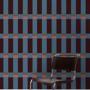 May include: A brown leather chair with a chrome frame sits in front of a wall with a geometric pattern. The pattern is made up of alternating vertical and horizontal stripes in shades of blue, brown, pink, and green.