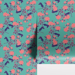 May include: A teal blue background with a repeating pattern of pink roses and dark blue leaves. The roses are in various stages of bloom, with some fully open and others still in bud.