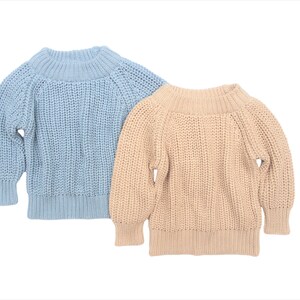 May include: Two knitted sweaters, one light blue and one beige, with a relaxed fit and a round neckline.