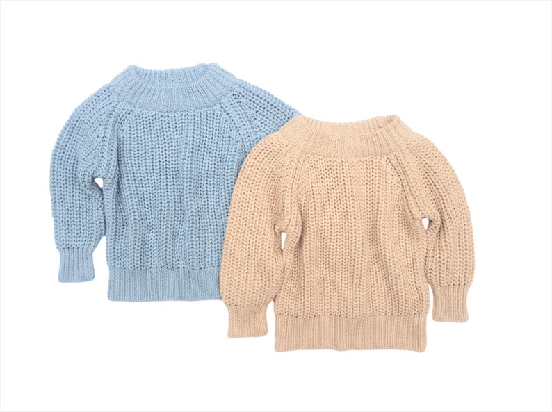 May include: Two knitted sweaters, one light blue and one beige, with a relaxed fit and a round neckline.