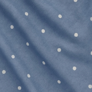 May include: Close-up of a blue fabric with a pattern of evenly spaced white polka dots. The fabric is slightly wrinkled, creating shadows and variations in the blue color. The polka dots are round and consistent in size.
