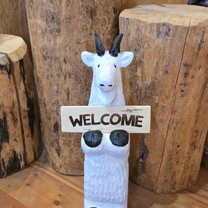 Chainsaw carved &quot;welcome goat&quot;