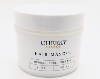 May include: White jar with a black label that reads "CHEEKY curls HAIR MASQUE HERBAL CURL THERAPY 2 OZ 59 ML".