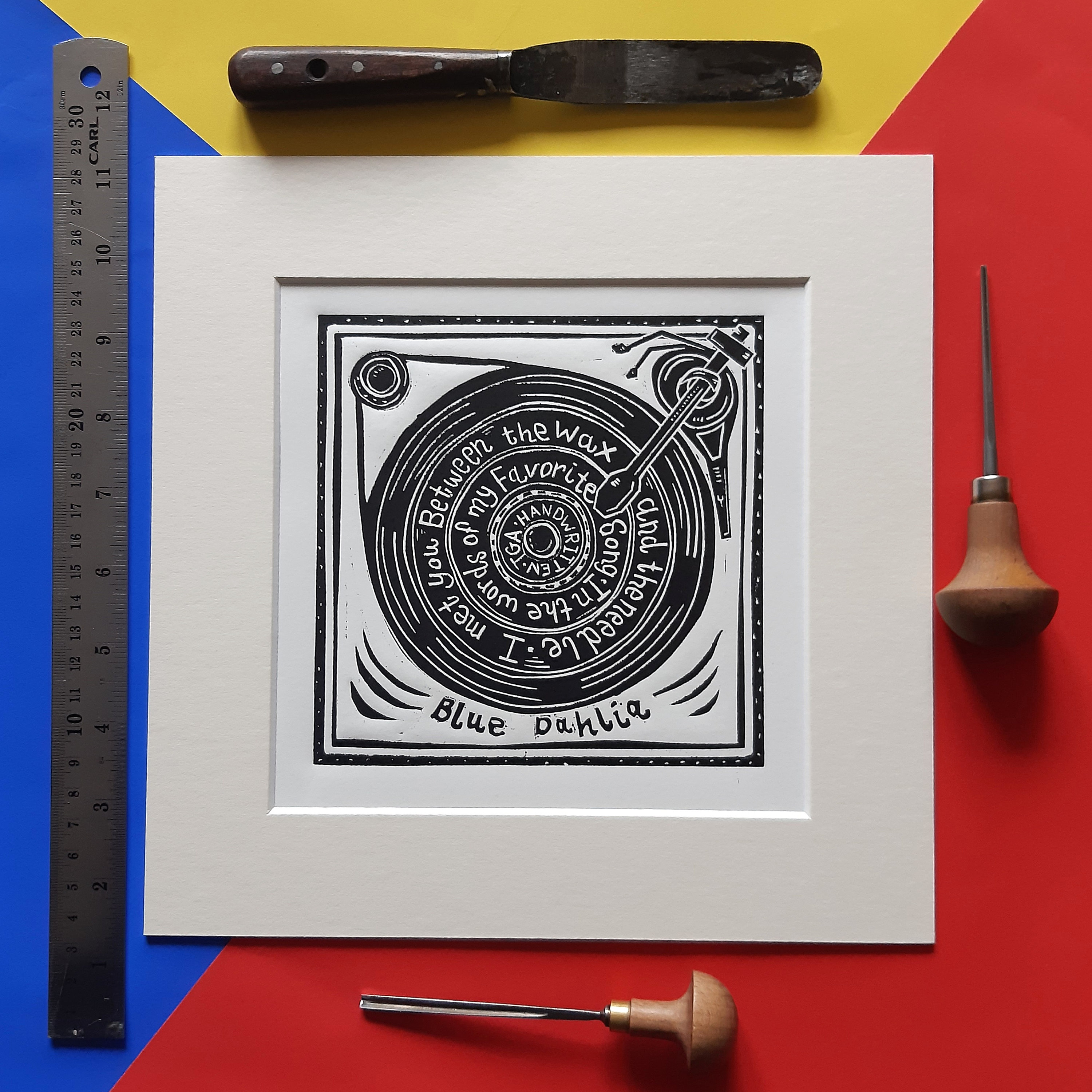 Blue Dahlia by The Gaslight Anthem. 10" x 10" linocut print by Pamela Scott. Handwritten. Brian Fallon. Record Player. vinyl. Lyrics.