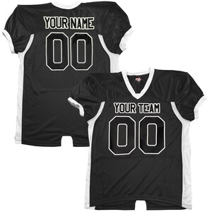 May include: Two black football jerseys with white detailing. One jersey has "YOUR NAME" and the number "00" in white. The other jersey shows "YOUR TEAM" and the number "00" in white. Both jerseys have a V-neck collar.