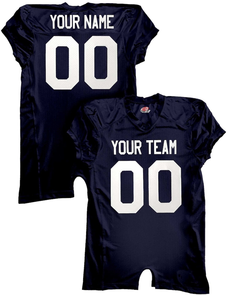 May include: Navy blue football jersey with white lettering. The back of the jersey says "YOUR NAME" and "00". The front of the jersey says "YOUR TEAM" and "00".