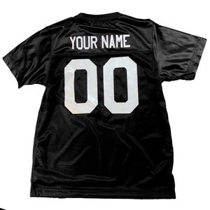 Black football jersey customized with just the name and number on the back.  The front will be blank.