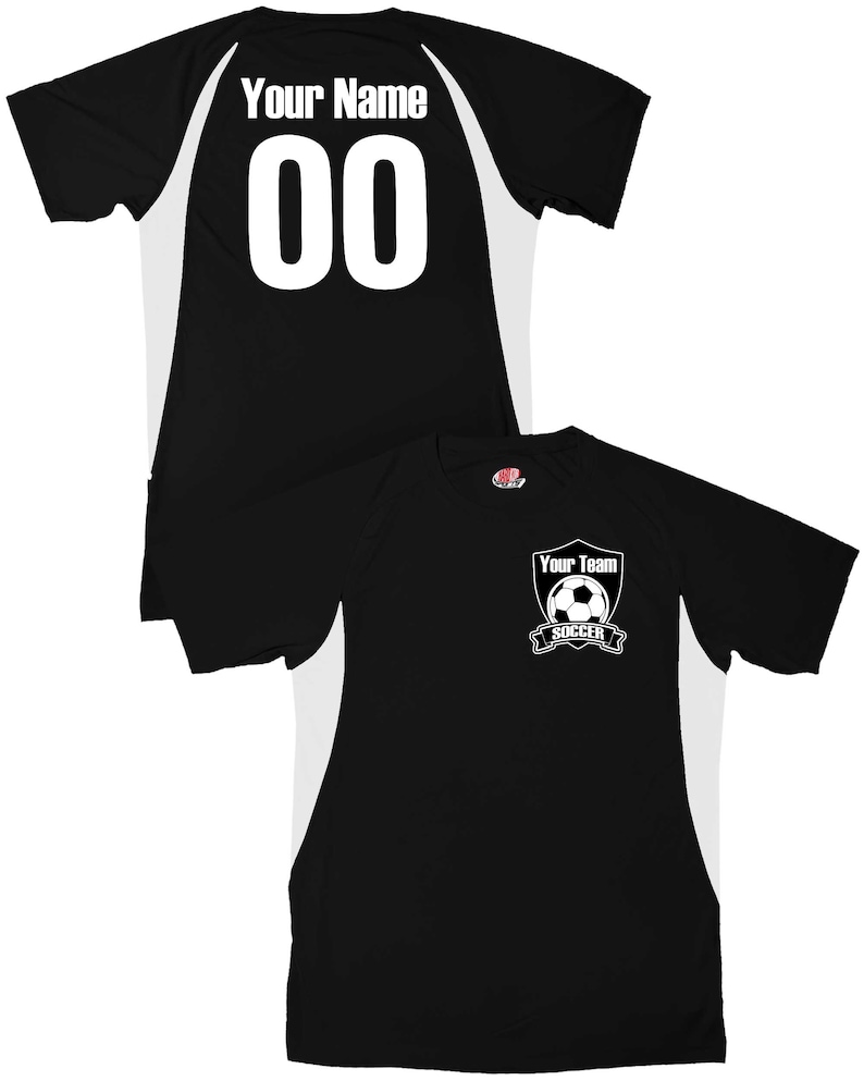May include: Black soccer jersey with white accents. The back of the jersey has a white number "00" and the text "Your Name". The front of the jersey has a white shield with a soccer ball and the text "Your Team Soccer".