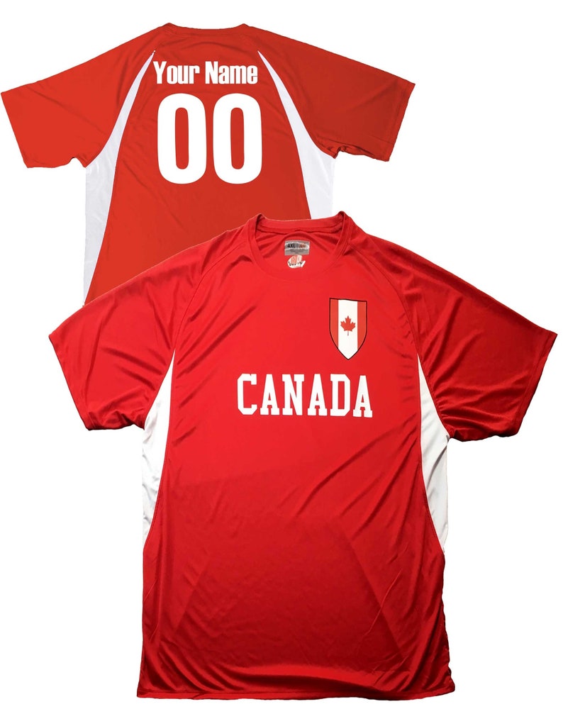 May include: Red athletic jersey with white accents and the word "CANADA" in white block letters. A Canadian flag emblem is on the chest. The back of the jersey has the text "Your Name" above the number "00".