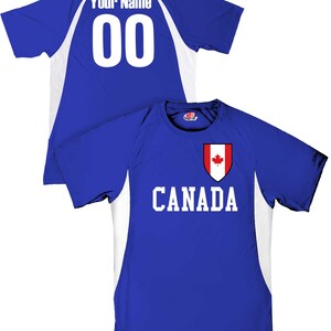 May include: Blue and white athletic jersey with the word "CANADA" in white block letters and a Canadian flag emblem. The back of the jersey has the number "00" in white and the words "Your Name" above it.