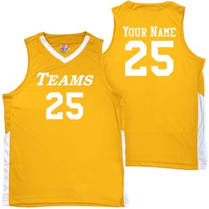gold and white basketball jersey with white heat applied vinyl lettering